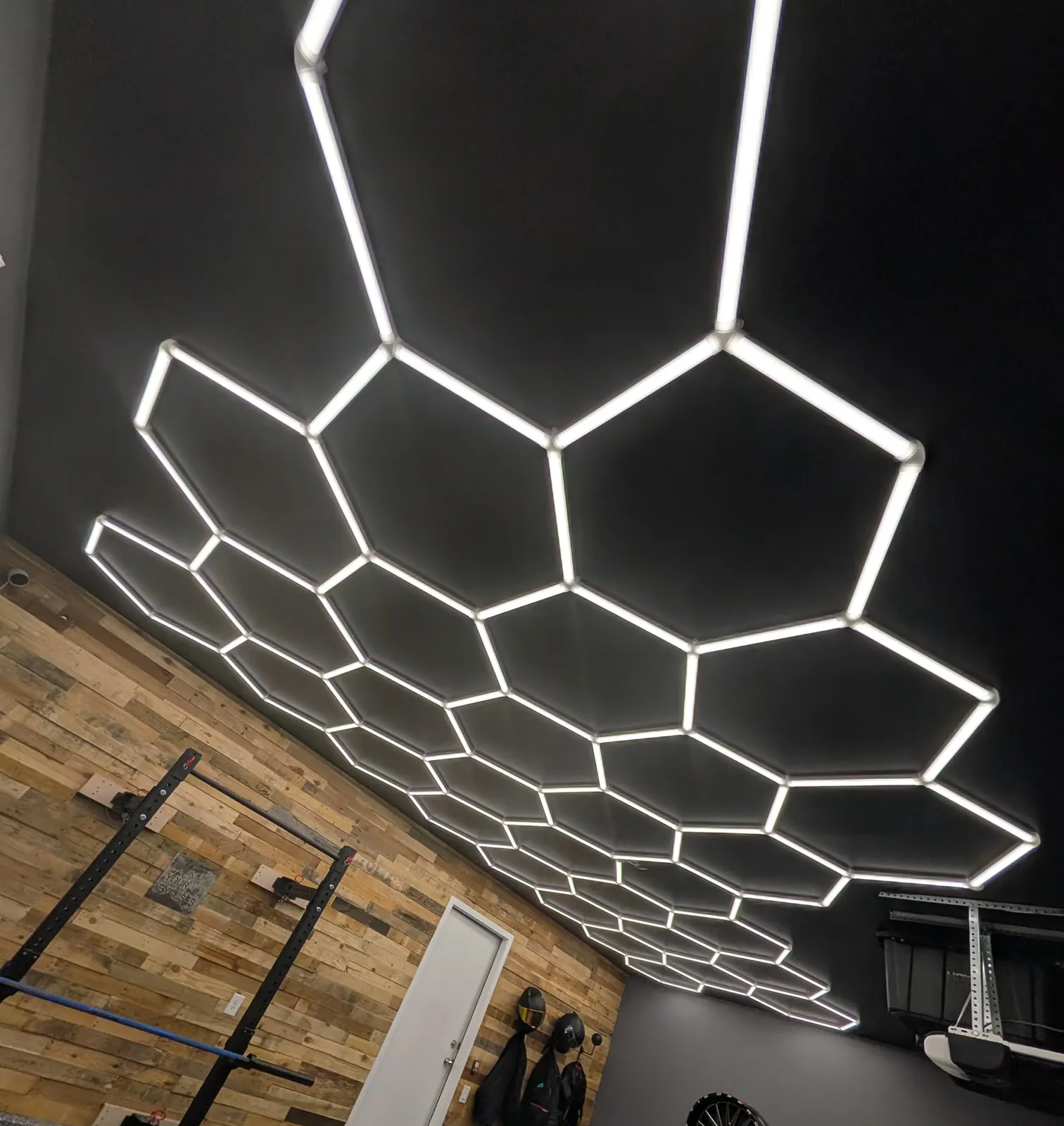 Hexagon LED ceiling lighting installed in a garage