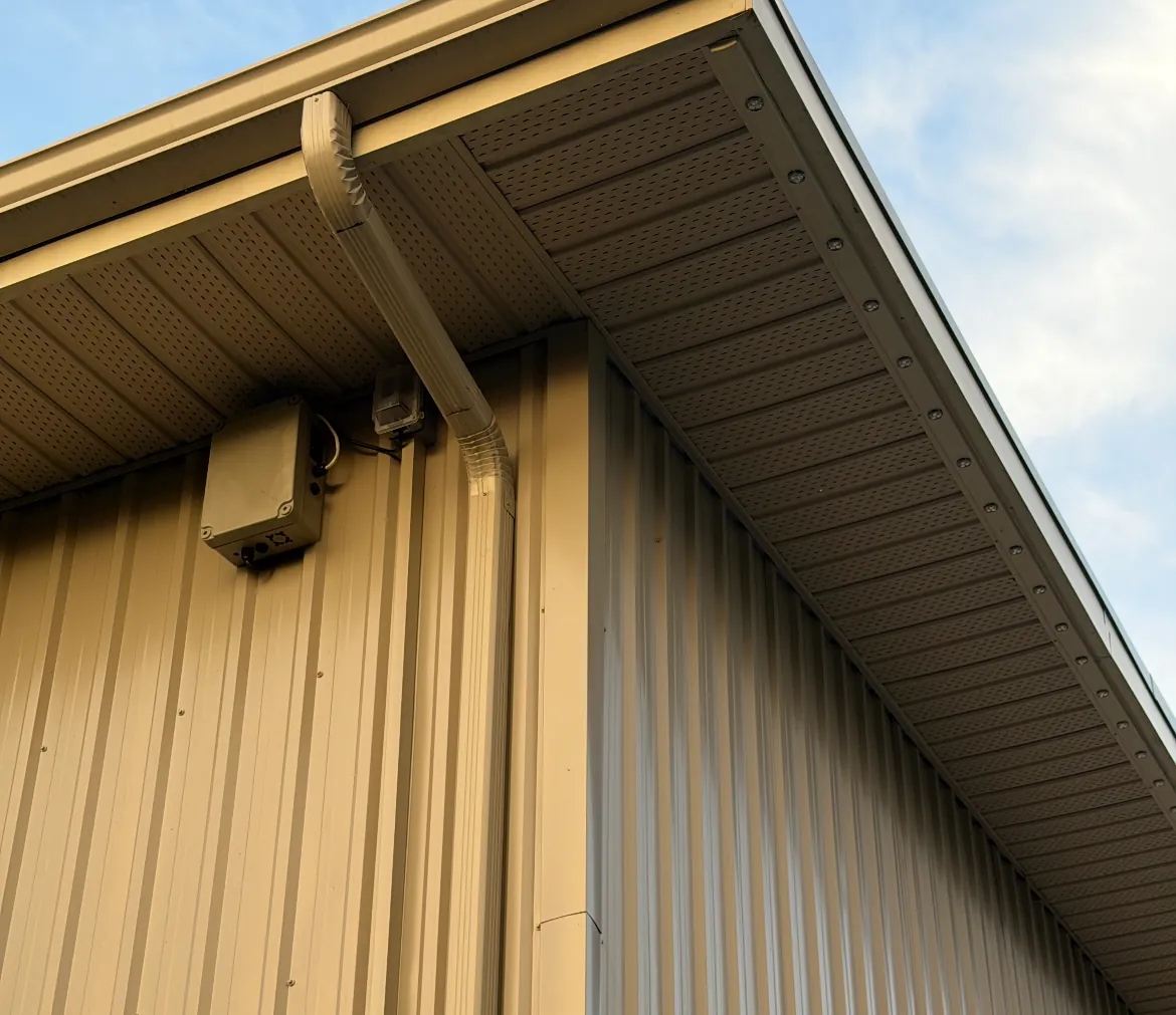 Weatherproof lighting power box mounted under a soffit